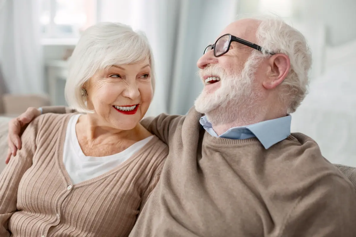 Benefits of Independent Living for Senior Couples Cheerful elderly man hugging his wife, representing the benefits of independent living at Alta Vista Senior Living in Prescott.